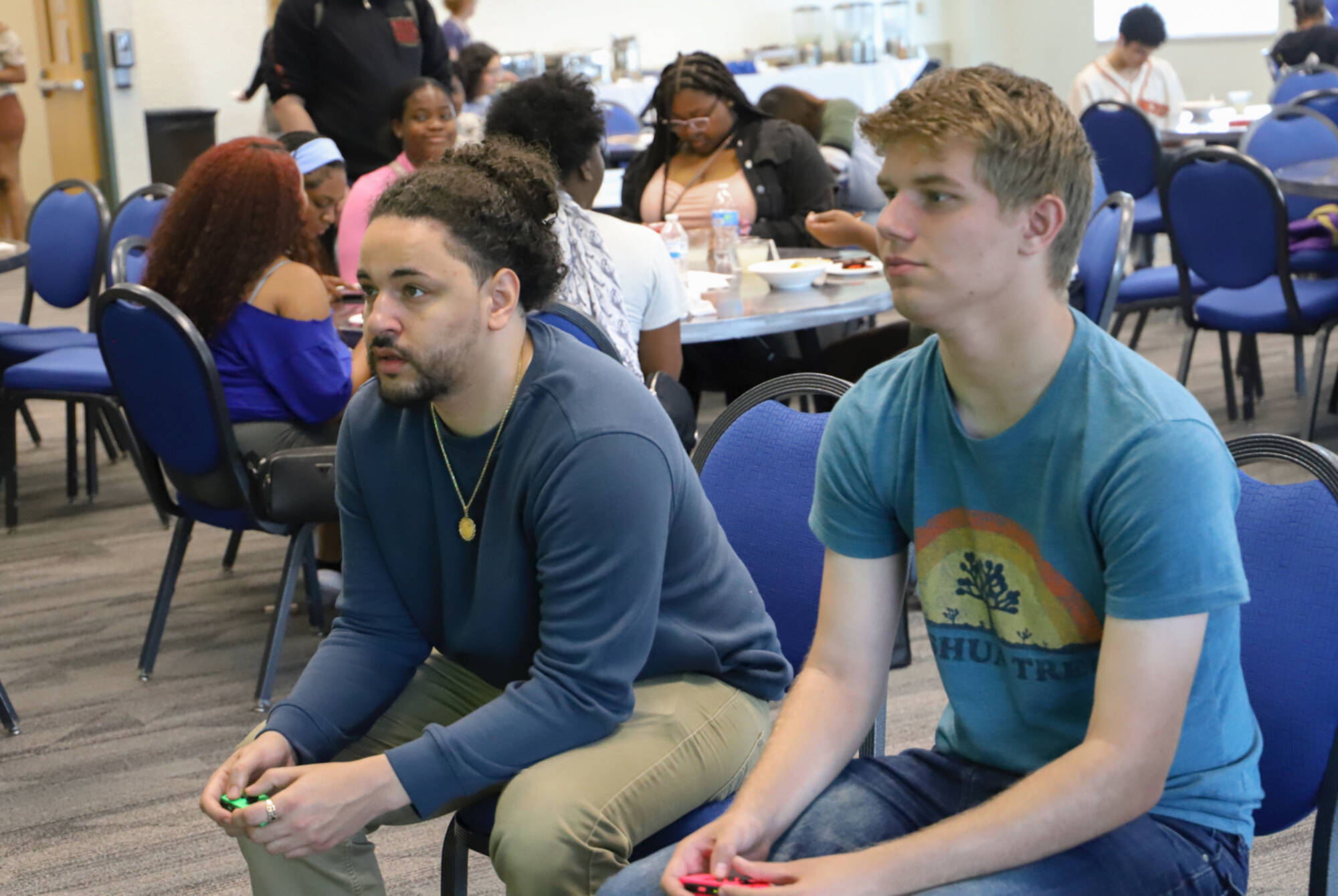 Graduate Assistant and student playing Nintendo Switch games